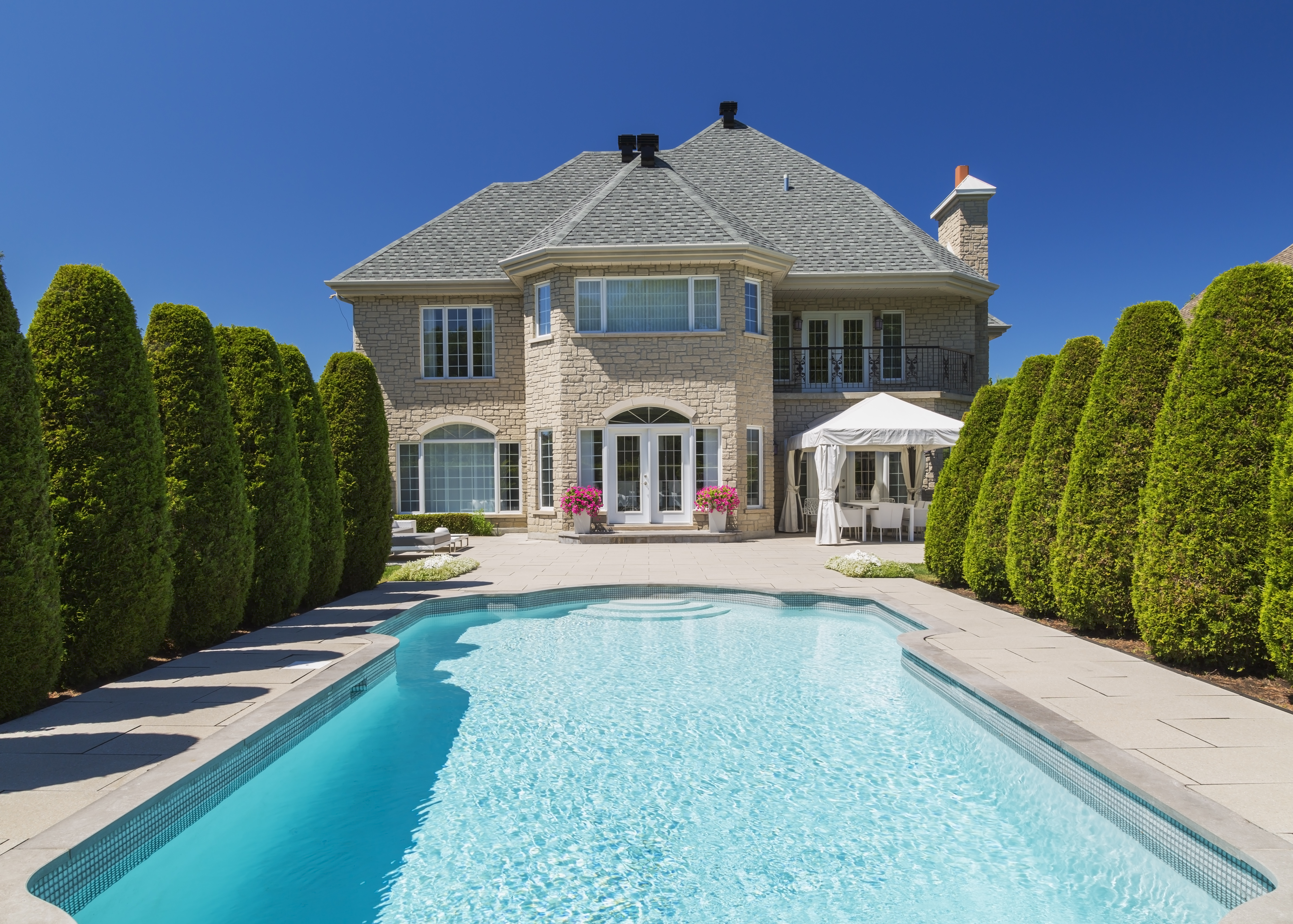 Outdoor pool bordered by cedar decking