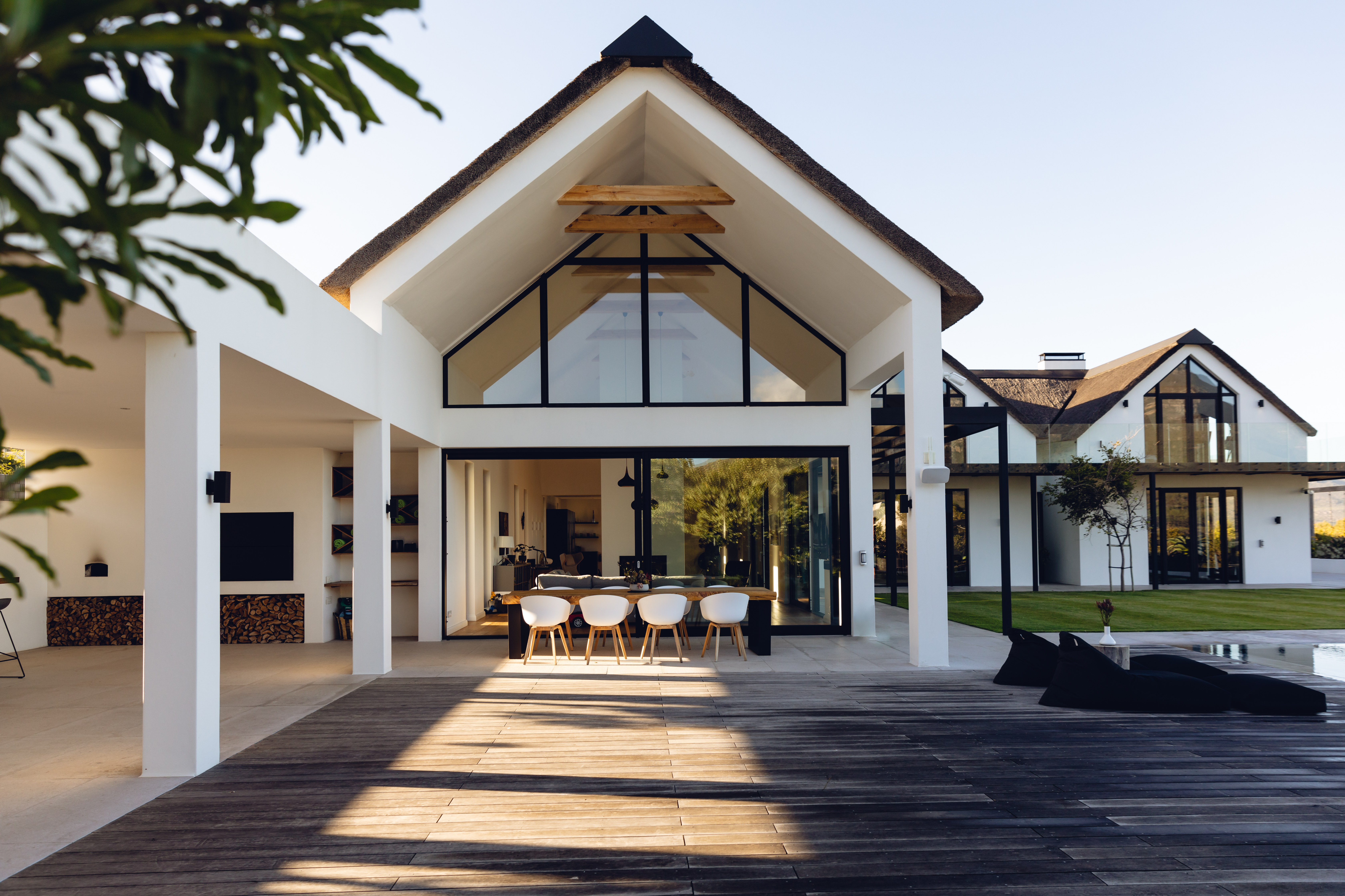 Luxurious modern house exterior with dining area